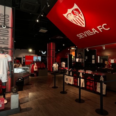 a group of people standing in front of a store